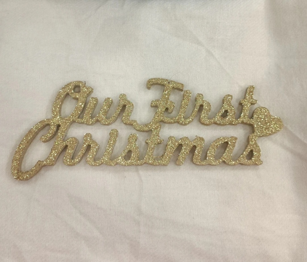 Our first Christmas ornament  (Gold)