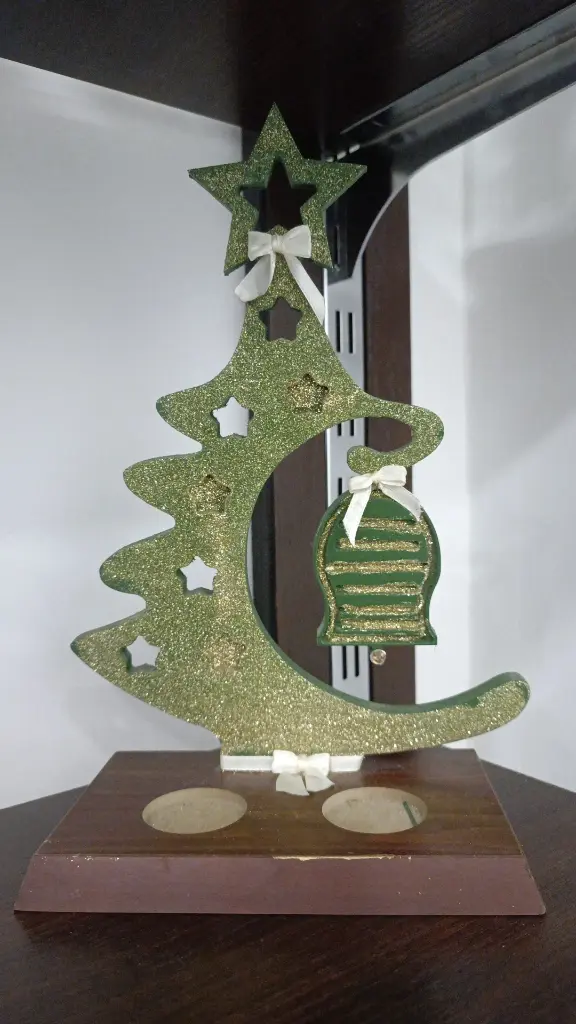 Small green tree with a bell 